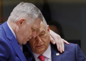 Slovakia's Prime Minister Robert Fico, left, speaks with Hungary's Prime Minister Viktor Orban during a round table meeting at an EU summit in Brussels, Thursday, March 20, 2025. (AP Photo/Omar Havana)