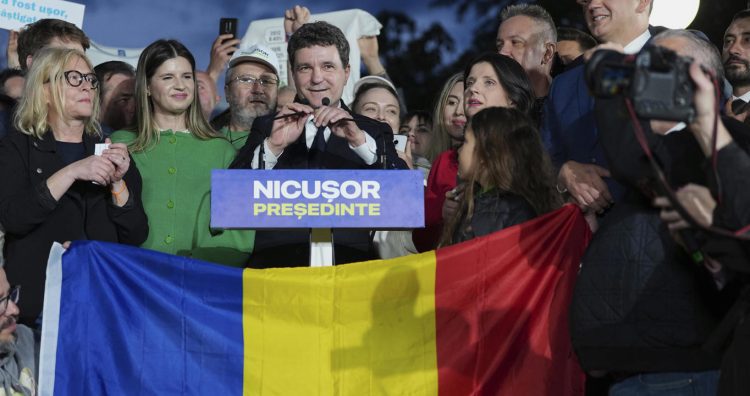 Presidential candidate Nicusor Dan speaks to media after polls closed for the second round of the country's presidential election redo in Bucharest, Romania, Sunday, May 18, 2025. (AP Photo/Andreea Alexandru)