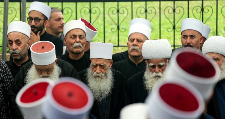 Lebanese Druze clerics attend a mass memorial mourning in the Lebanese city of Alliyeh for hundreds of Lebanese Druze who were killed in the sectarian fighting between Druze fighters and Sunni Muslim Bedouin gunmen in the southern Syria's Sweida province. An uneasy calm returned to Sweida, after fighters withdrew following a week of violence estimated to have killed more than 1,000 people. The clashes in Syria have heightened fears of sectarian violence spreading to Lebanon, given the significant Druze and Sunni populations in both countries.
Lebanese Druze Mourn Relatives Killed In Sectarian Clashes In Syria, Alliyeh, Lebanon - 22 Jul 2025,Image: 1024391981, License: Rights-managed, Restrictions: , Model Release: no, Credit line: ZUMA Press Wire / Shutterstock Editorial / Profimedia