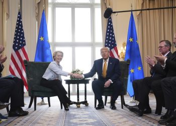 President Donald Trump and European Commission President Ursula von der Leyen shake hands after reaching a trade deal at the Trump Turnberry golf course in Turnberry, Scotland Sunday, July 27, 2025. (AP Photo/Jacquelyn Martin)