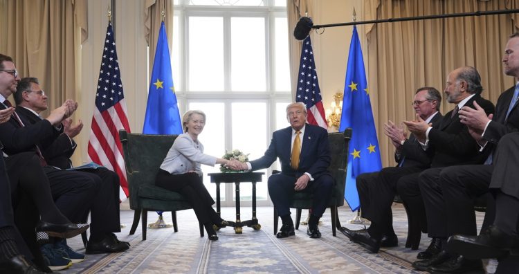 President Donald Trump and European Commission President Ursula von der Leyen shake hands after reaching a trade deal at the Trump Turnberry golf course in Turnberry, Scotland Sunday, July 27, 2025. (AP Photo/Jacquelyn Martin)