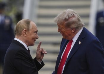 President Donald Trump greets Russia's President Vladimir Putin on the tarmac at Joint Base Elmendorf-Richardson in Anchorage, Alaska, Aug. 15, 2025. (AP Photo/Julia Demaree Nikhinson)