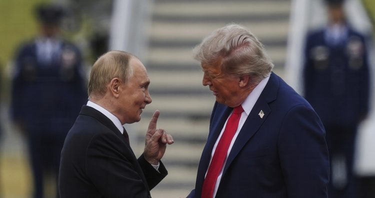President Donald Trump greets Russia's President Vladimir Putin on the tarmac at Joint Base Elmendorf-Richardson in Anchorage, Alaska, Aug. 15, 2025. (AP Photo/Julia Demaree Nikhinson)
