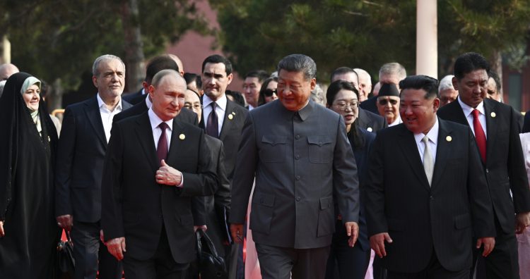 From left in the front row: Russian President Vladimir Putin, Chinese President Xi Jinping and North Korean leader Kim Jong Un walk after a joint photo session of the heads of foreign delegations invited to the military parade to mark the 80th anniversary of Japan's World War II surrender, in Beijing, China, Wednesday, Sept. 3, 2025. (Sergei Bobylev, Sputnik, Kremlin Pool Photo via AP)