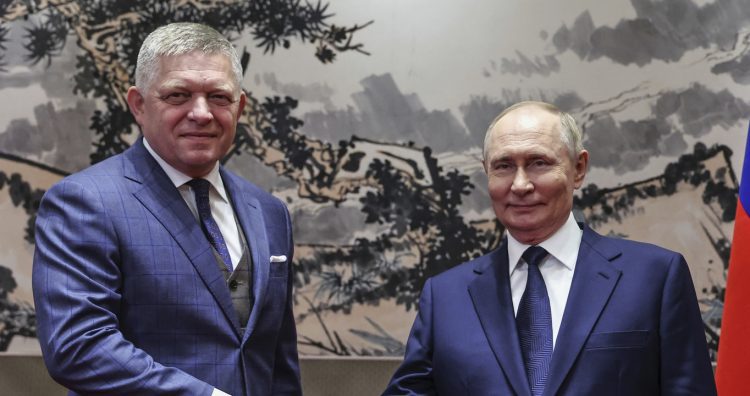 Russian President Vladimir Putin, right, and Slovak Prime Minister Robert Fico shake hands during their meeting at the Diaoyutai State Guesthouse in Beijing, China, Tuesday, Sept. 2, 2025. (Alexander Kazakov, Sputnik, Kremlin Pool Photo via AP)