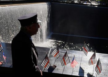 William Staudt, a firefighter that worked at Ground Zero on the day of the attacks, looks over a reflecting pool during a ceremony to mark the 24th anniversary of the 9/11 attacks, Thursday, Sept. 11, 2025, in New York. (AP Photo/Seth Wenig)