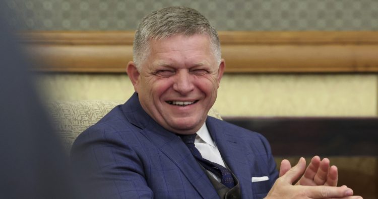 Slovak Prime Minister Robert Fico smiles during his meeting with Russian President Vladimir Putin at the Diaoyutai State Guesthouse in Beijing, China, Tuesday, Sept. 2, 2025. (Alexander Kazakov, Sputnik, Kremlin Pool Photo via AP)