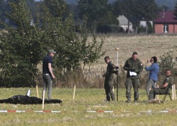 Police and Military Police secure parts of a damaged UAV shot down by Polish authorities at a site in Wohyn, Poland, Wednesday, Sept. 10, 2025.(AP Photo)