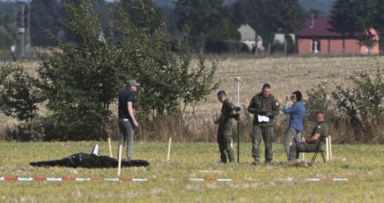 Police and Military Police secure parts of a damaged UAV shot down by Polish authorities at a site in Wohyn, Poland, Wednesday, Sept. 10, 2025.(AP Photo)
