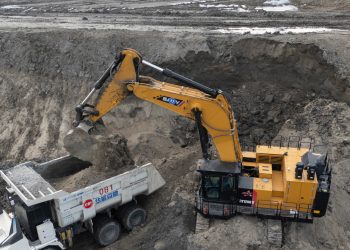 An excavator loads an autonomous mining truck in the Huaneng Yimin open-pit coal mine in Hulunbuir in northern China's Inner Mongolia province China, Monday, Sept. 15, 2025. (AP Photo/Ng Han Guan)
