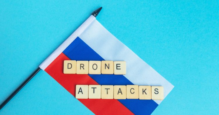 The National Flag of The Russian Federation, along with a sign reading Drone Attacks,Image: 981863535, License: Royalty-free, Restrictions: , Model Release: yes, Credit line: - / DPphoto / Profimedia